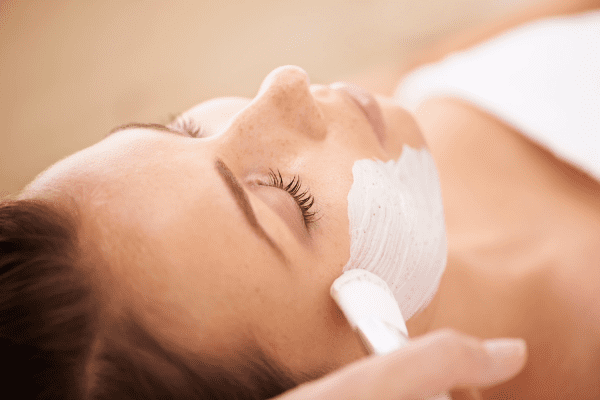 Woman receiving a facial treatment