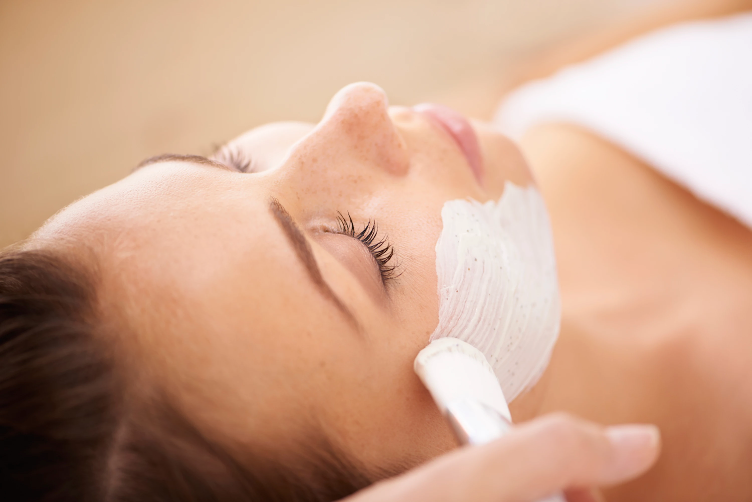 Woman receiving a facial treatment