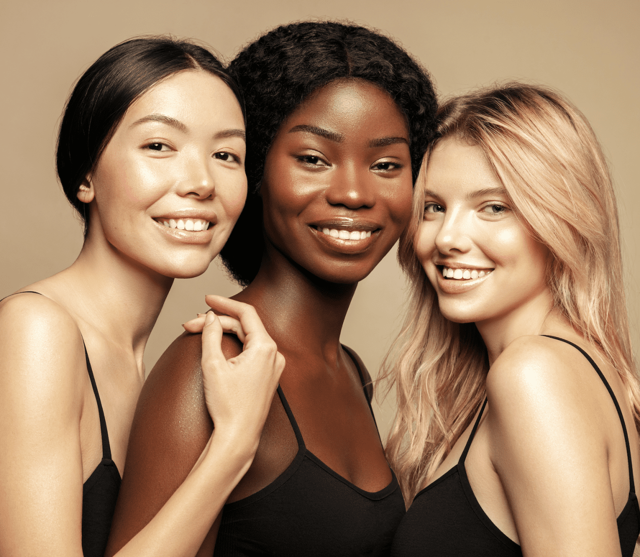 Three women looking happy and standing together