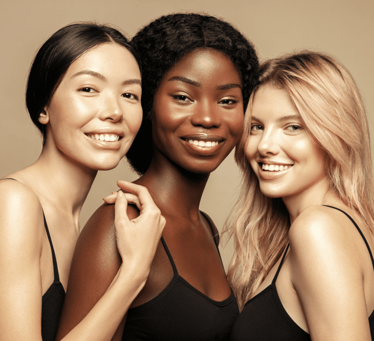 Three women looking happy and standing together