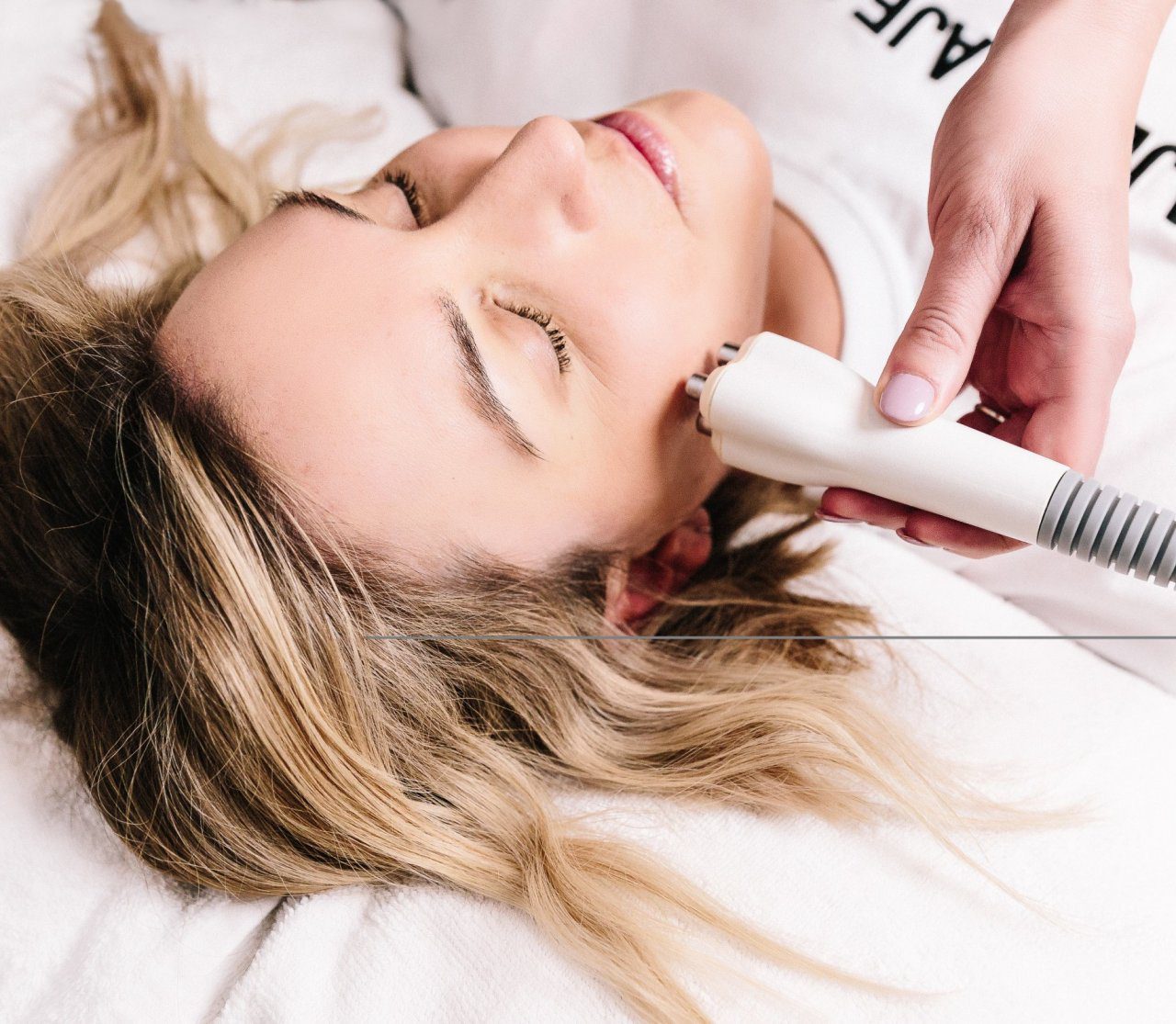 A woman undergoing a skin tightening treatment