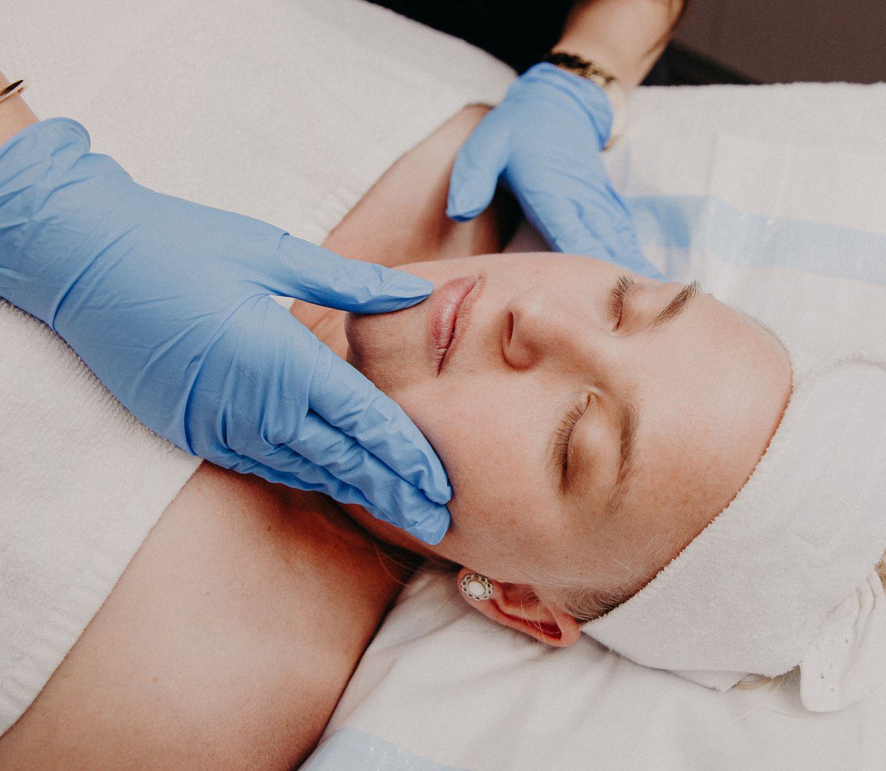 A woman receiving a facial