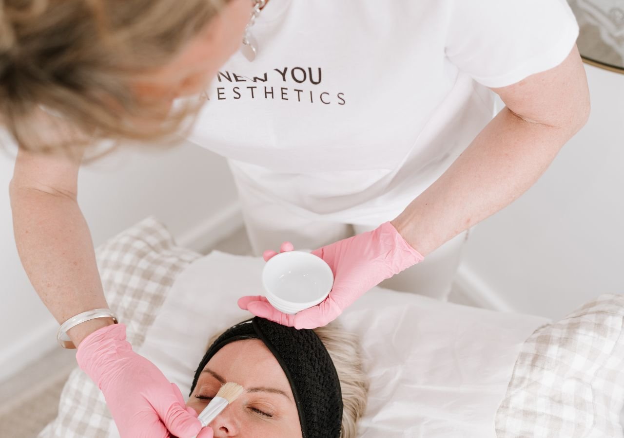 A beautician doing a skin treatment on a customer