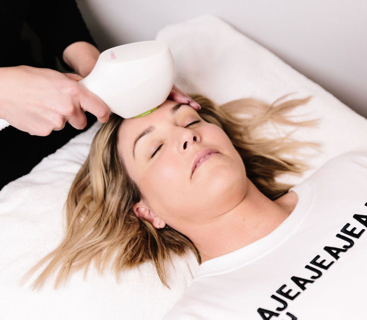 A woman receiving a skin treatment