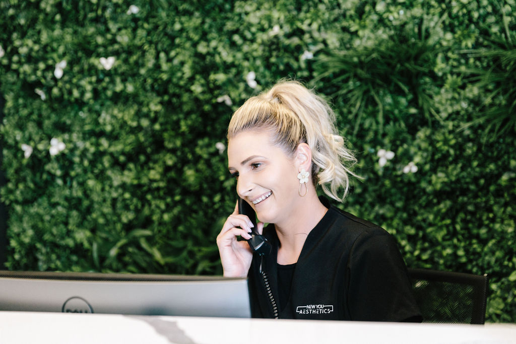 A receptionist talks on the phone