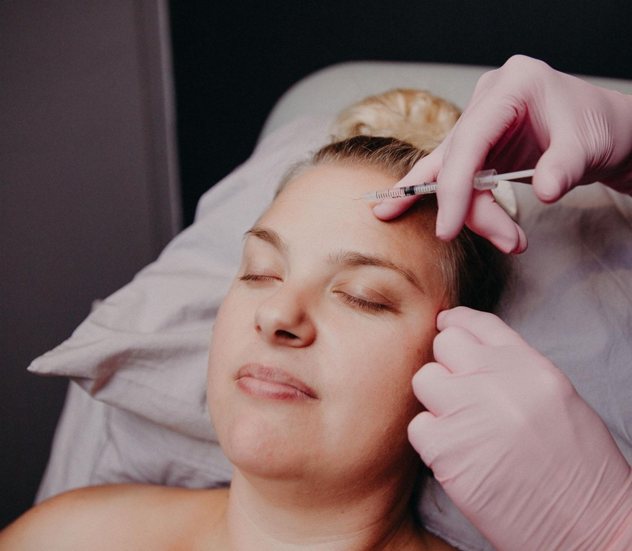 Women having injection in her forehead