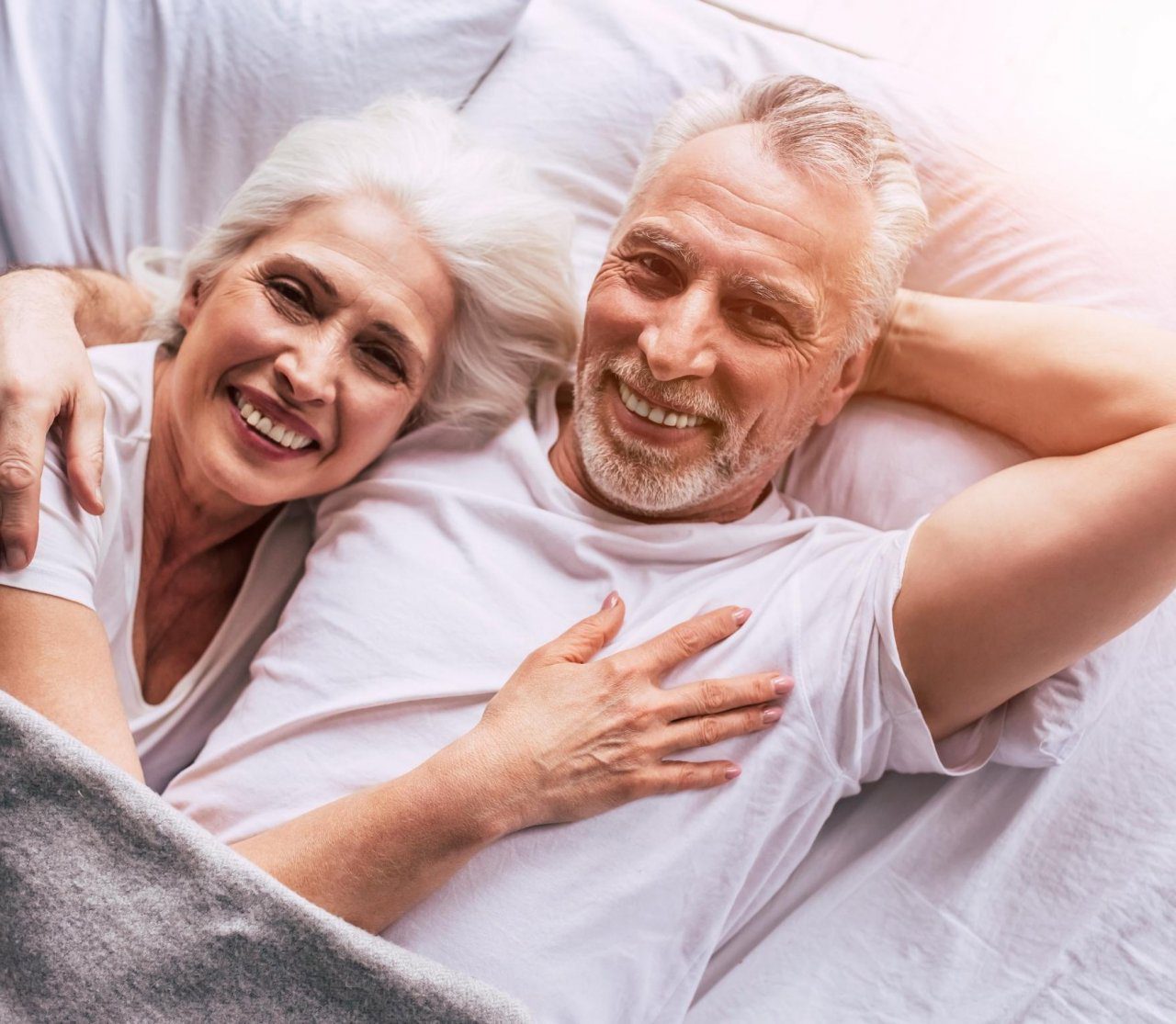 A couple lying in bed together